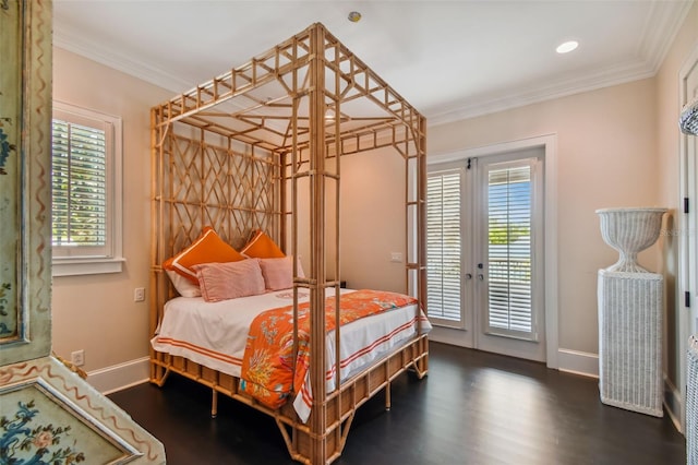 bedroom featuring crown molding, french doors, access to outside, and dark hardwood / wood-style flooring