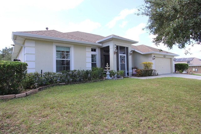 1545 Blue Sky Blvd, Haines City, FL 33844 - ranch-style home featuring a front yard, an attached garage, driveway, stucco siding, and roof with shingles