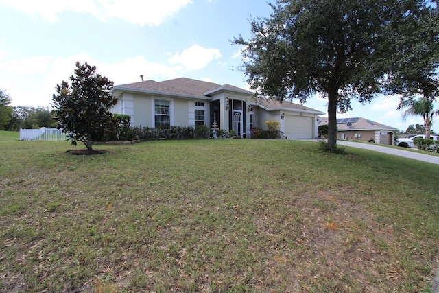 single story home featuring a front yard and a garage