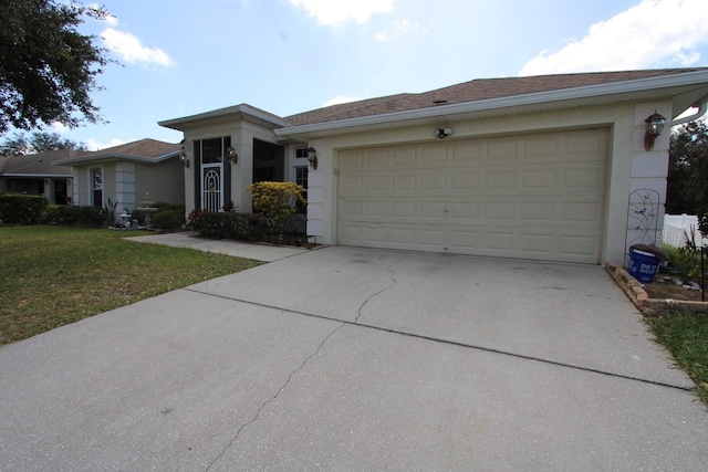 ranch-style home with a front lawn and a garage