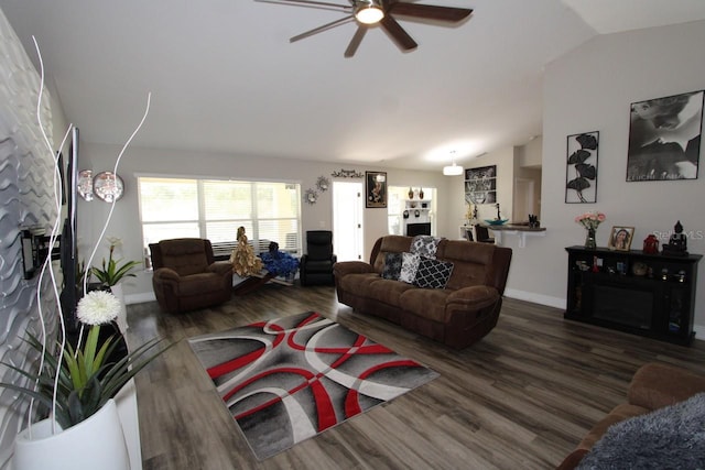 living room with dark wood-type flooring, ceiling fan, and lofted ceiling