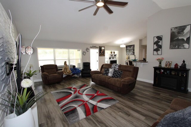 1545 Blue Sky Blvd, Haines City, FL 33844 - living area with lofted ceiling, a ceiling fan, wood finished floors, and baseboards