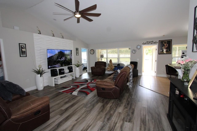 living room with wood-type flooring, high vaulted ceiling, and ceiling fan