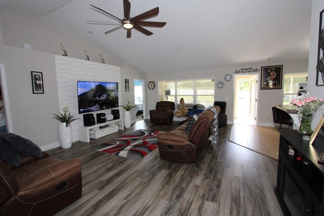 1545 Blue Sky Blvd, Haines City, FL 33844 - living room with ceiling fan, lofted ceiling, wood finished floors, and baseboards