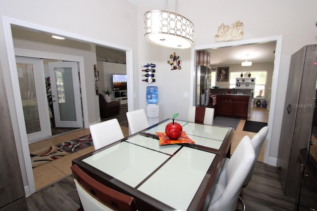 dining space featuring sink and dark hardwood / wood-style flooring