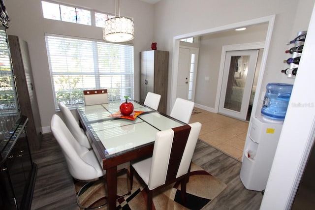 dining space with dark wood-type flooring