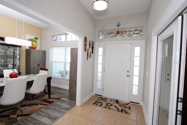 entryway featuring light tile patterned floors