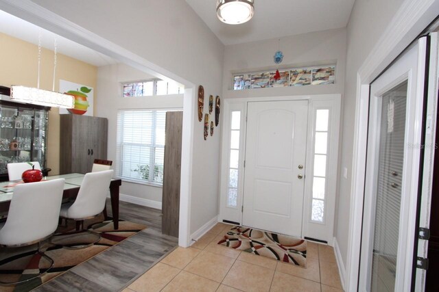 1545 Blue Sky Blvd, Haines City, FL 33844 - tiled foyer entrance featuring baseboards