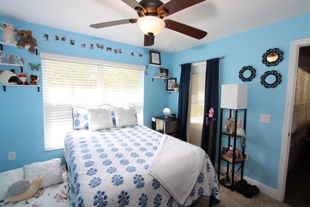 carpeted bedroom featuring ceiling fan