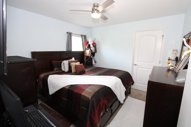 bedroom featuring light colored carpet and ceiling fan