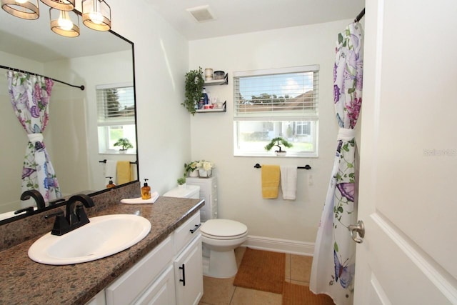 bathroom with vanity, a notable chandelier, toilet, and tile patterned flooring