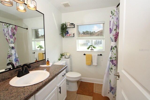 1545 Blue Sky Blvd, Haines City, FL 33844 - full bathroom with tile patterned floors, toilet, vanity, a chandelier, and a shower with curtain