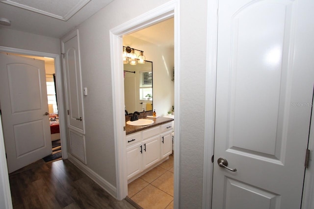 hallway with sink and dark hardwood / wood-style floors