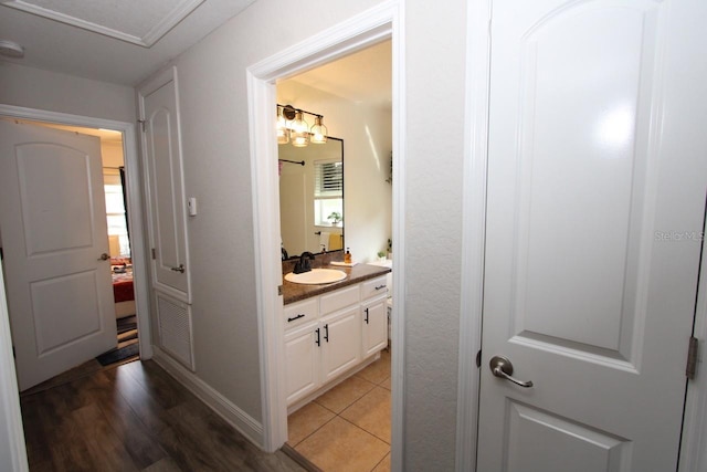 1545 Blue Sky Blvd, Haines City, FL 33844 - bathroom with vanity, wood finished floors, and ensuite bathroom