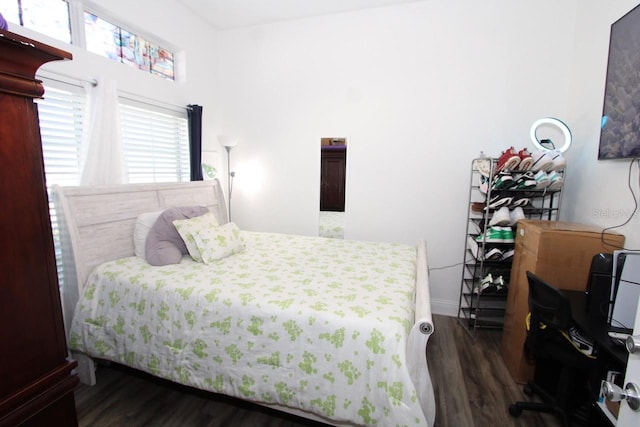 bedroom featuring dark hardwood / wood-style floors