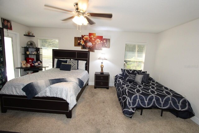 1545 Blue Sky Blvd, Haines City, FL 33844 - bedroom with carpet flooring, baseboards, and a ceiling fan