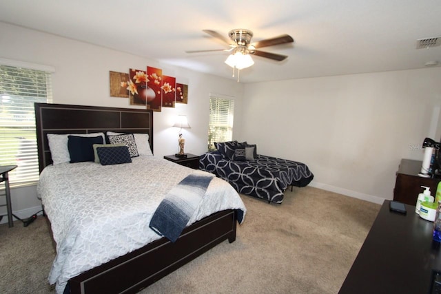 bedroom featuring ceiling fan and carpet floors