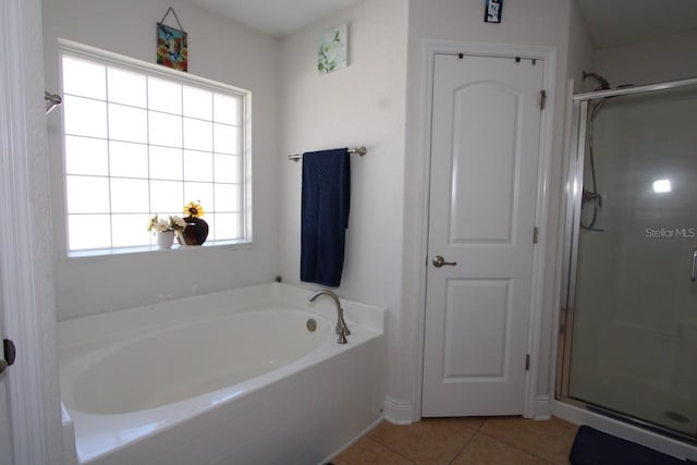 bathroom featuring independent shower and bath and tile patterned flooring