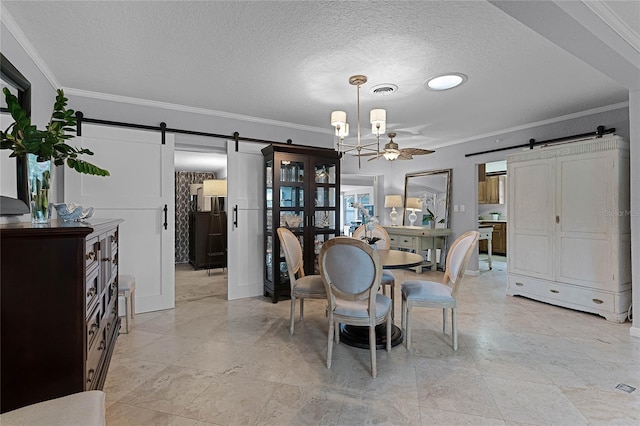 dining area featuring ornamental molding, a barn door, and ceiling fan with notable chandelier