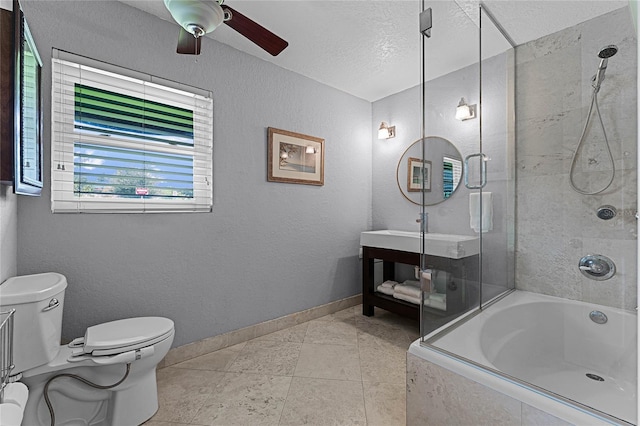 full bathroom featuring toilet, tile patterned flooring, tiled shower / bath, a textured ceiling, and ceiling fan