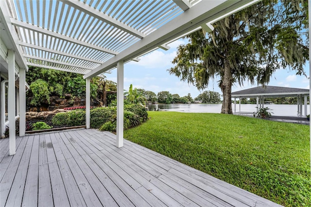 wooden deck with a gazebo, a yard, a water view, and a pergola