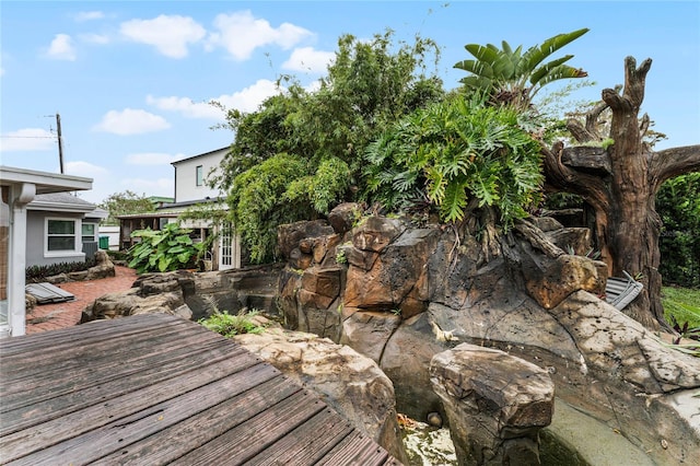 wooden terrace featuring a patio