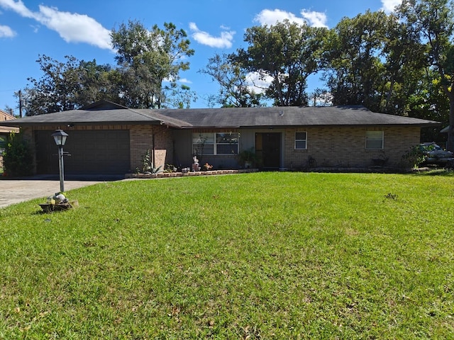 single story home with a front yard and a garage