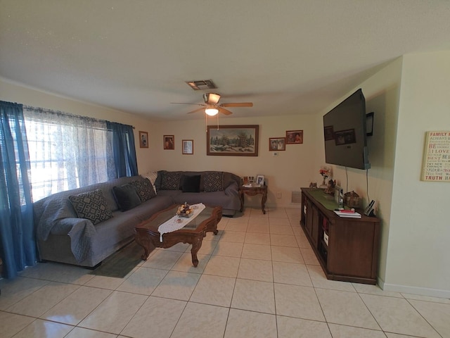 living room featuring light tile patterned floors and ceiling fan