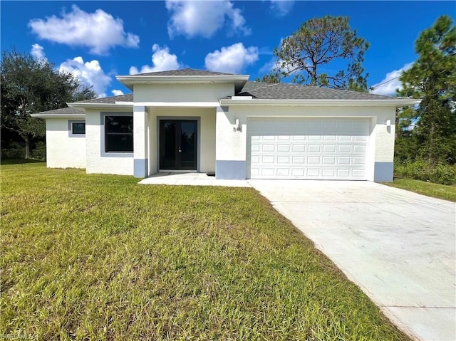 view of front facade with a front lawn and a garage