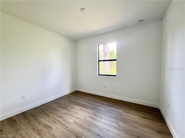 empty room featuring hardwood / wood-style flooring