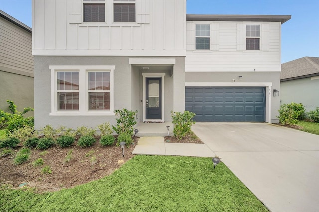 view of front facade with a front yard and a garage