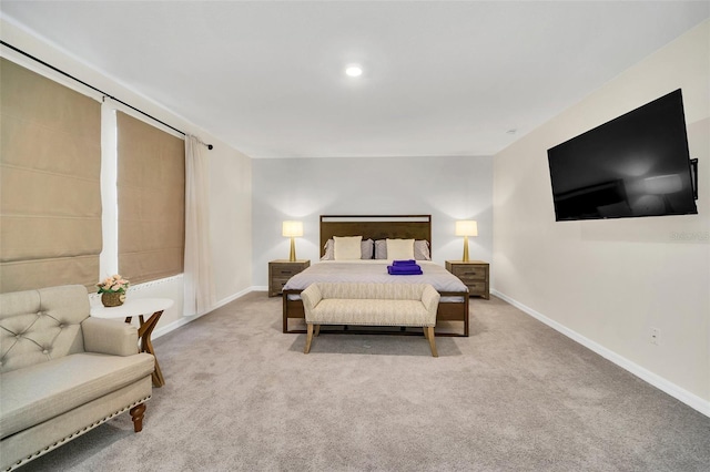 bedroom with light colored carpet