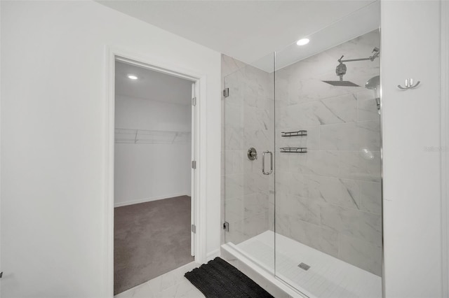 bathroom with a shower with door