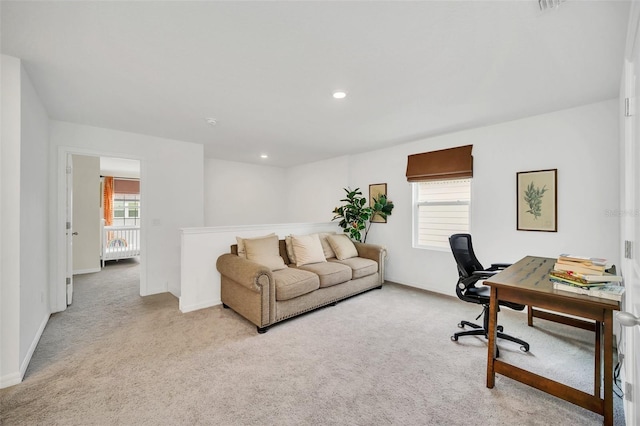 office with a wealth of natural light and light colored carpet