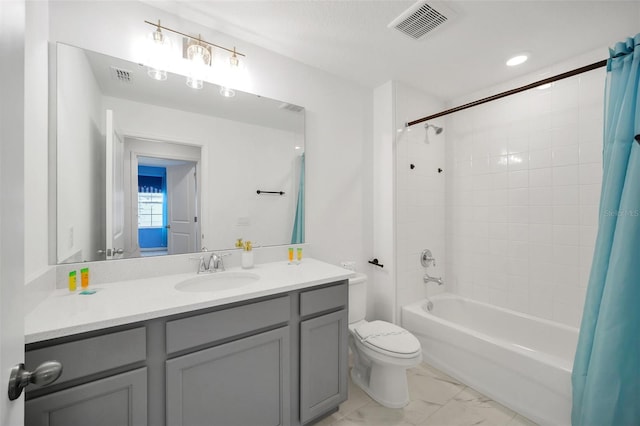 full bathroom featuring toilet, shower / bath combination with curtain, and vanity