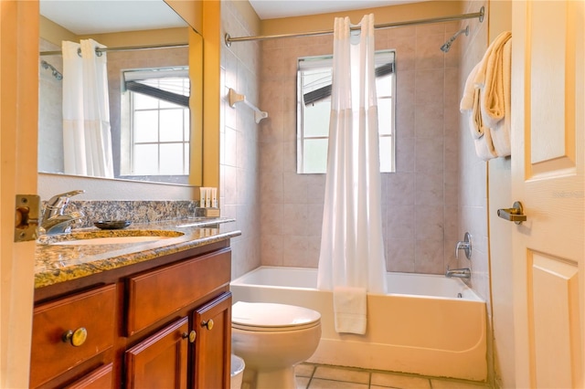 full bathroom featuring shower / bath combo, toilet, plenty of natural light, and tile patterned floors