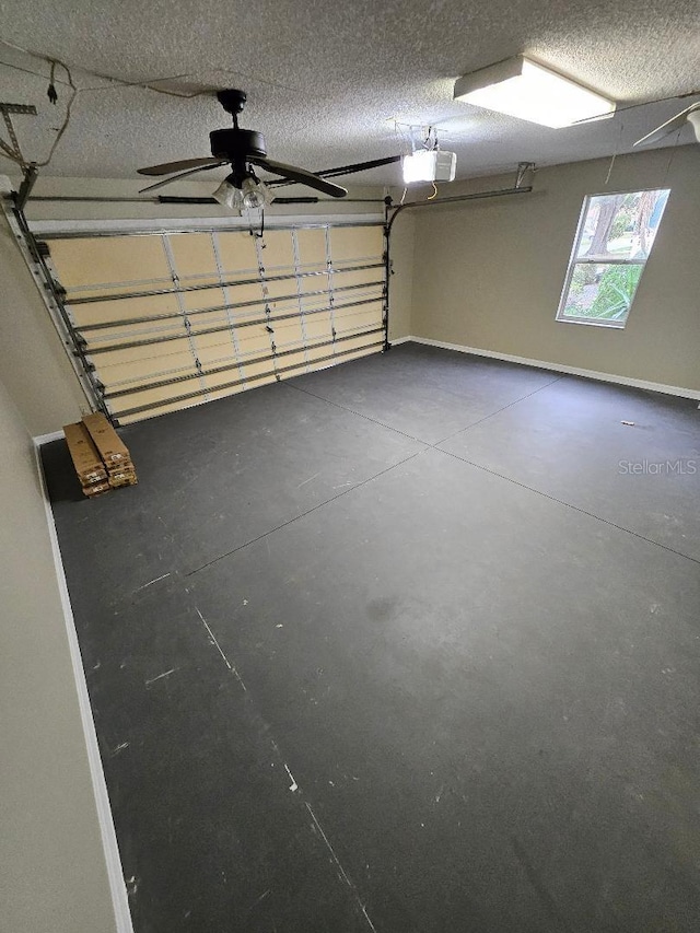 garage with a garage door opener and ceiling fan