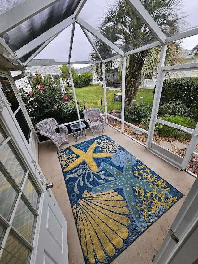 sunroom featuring vaulted ceiling