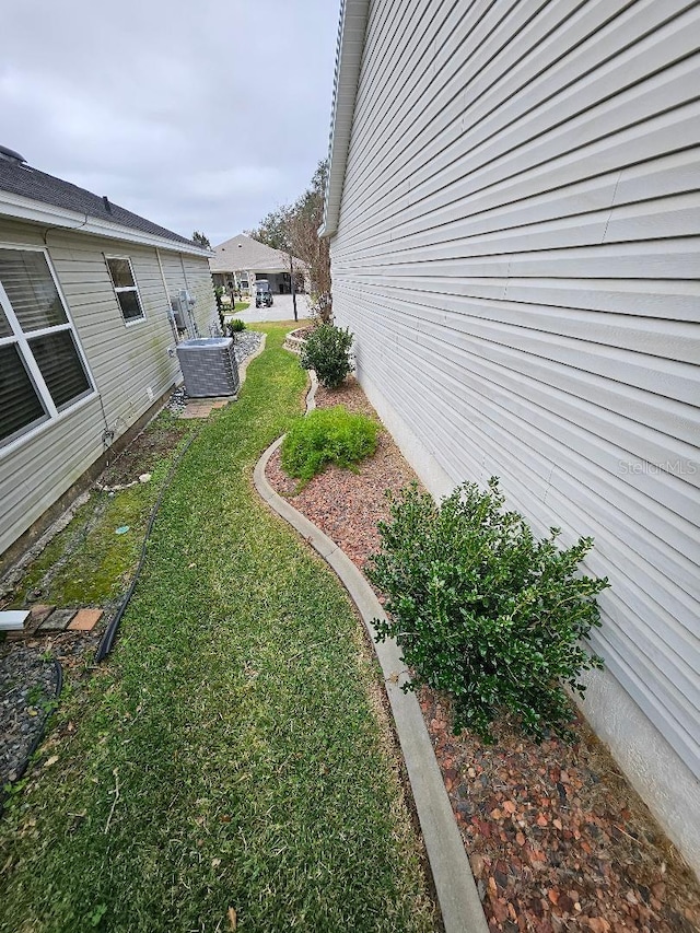 view of yard with central AC