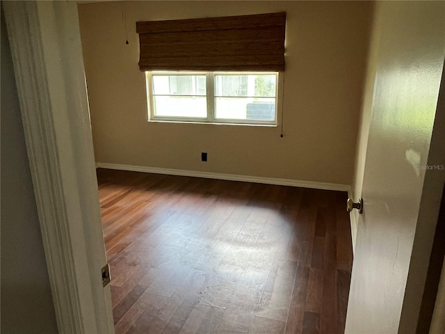 unfurnished room featuring wood-type flooring