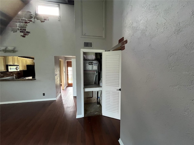 hallway with dark wood-type flooring