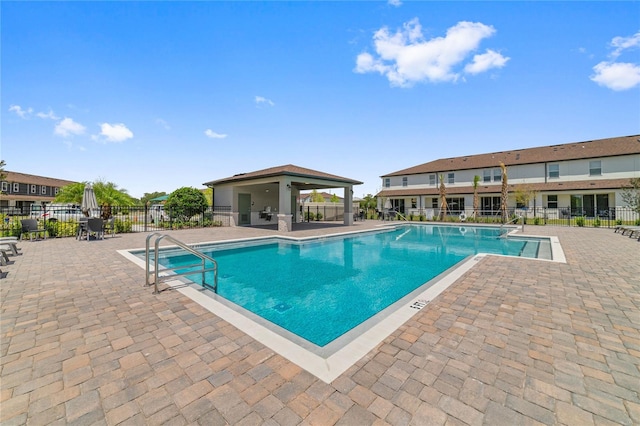 view of pool featuring a gazebo and a patio area