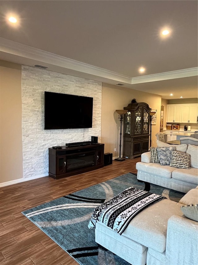 living room with ornamental molding and dark wood-type flooring