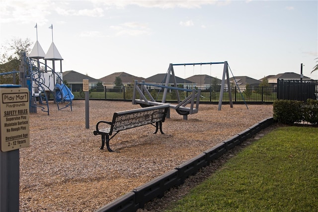 view of playground with a lawn