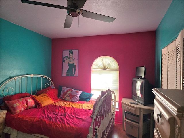 bedroom featuring ceiling fan and wood-type flooring