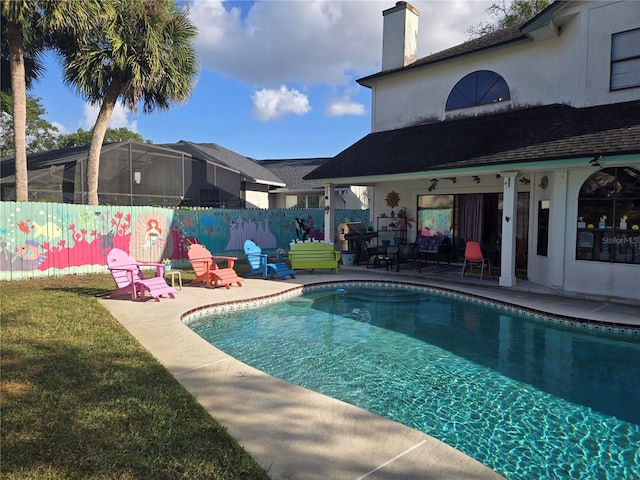 view of pool featuring a patio, ceiling fan, and a lawn