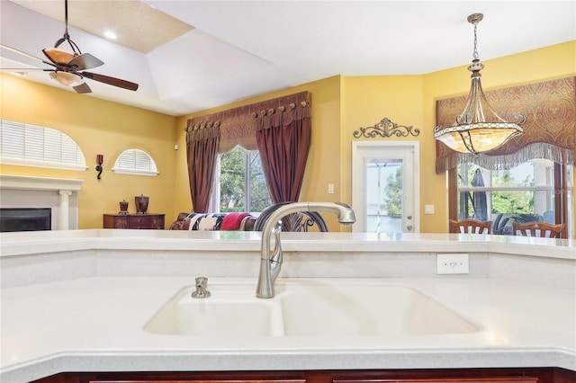 kitchen with ceiling fan, sink, plenty of natural light, and pendant lighting