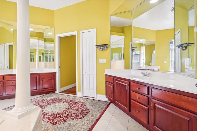 bathroom featuring vanity, tile patterned floors, and decorative columns