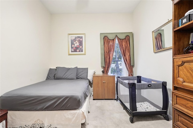 bedroom with light colored carpet