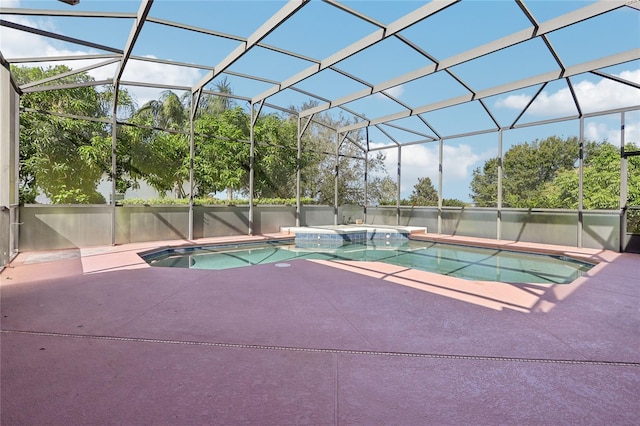 view of swimming pool featuring a patio area and a lanai